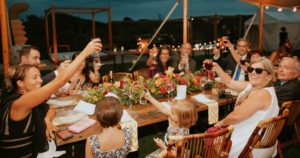 People sitting beside table