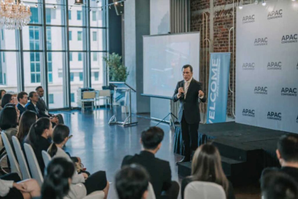 Man speaking to event attendees