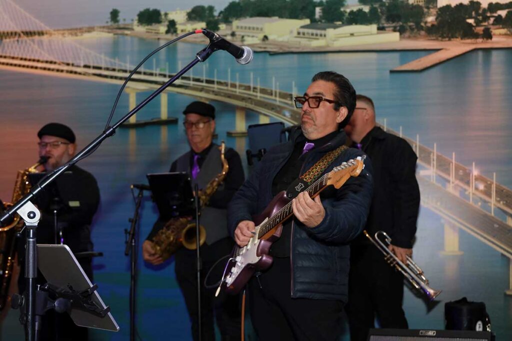 Musicians performing on stage at an event